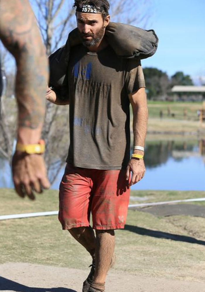 Adam Lerner training with a sandbag